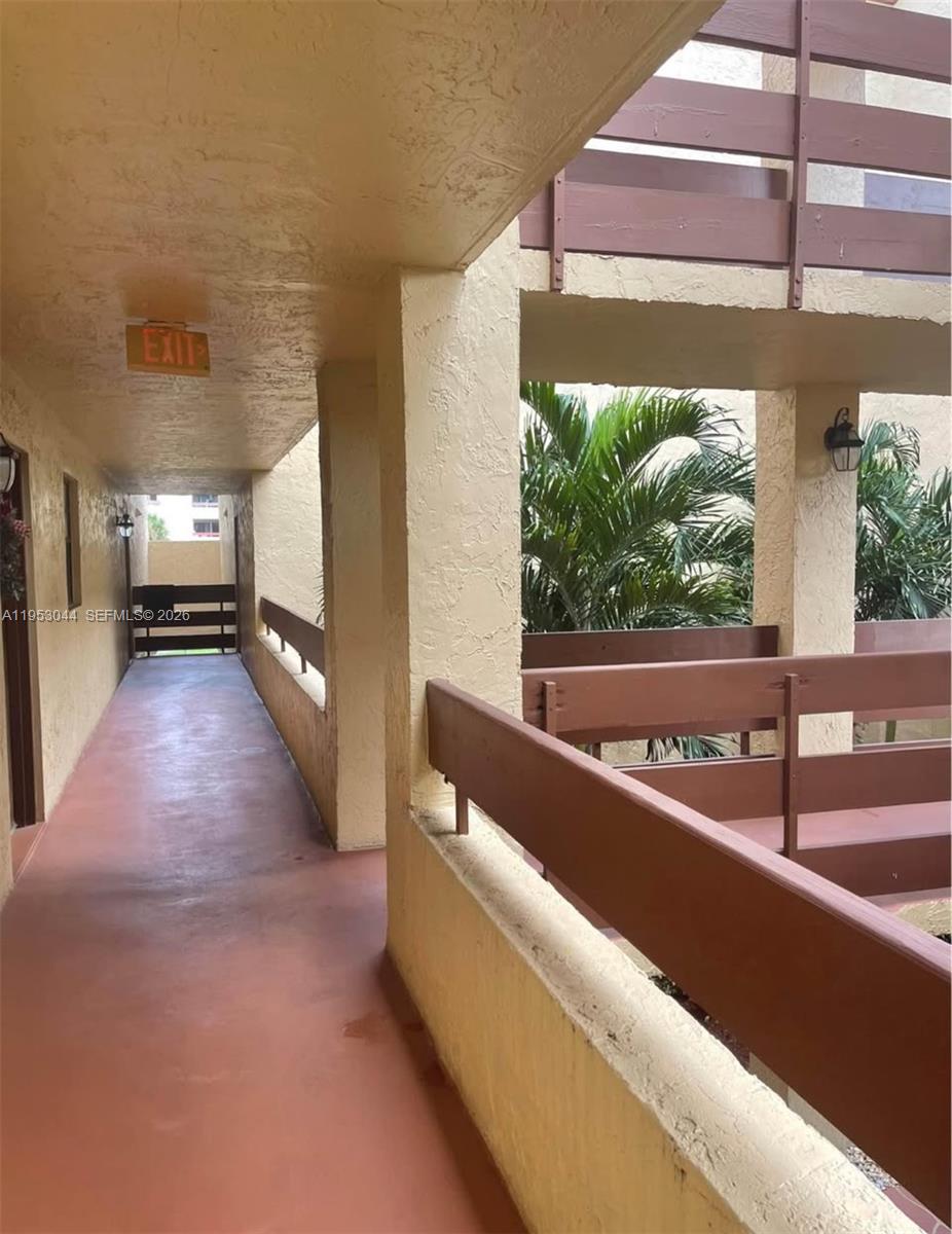 9015 Southwest 125th Avenue, Unit N209 Miami, FL 33186 - Photo 18 of 18 a view of a living room with a floor to ceiling window and kitchen