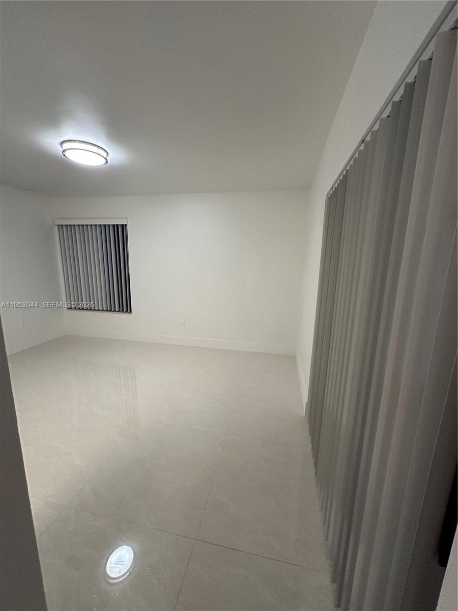 9015 Southwest 125th Avenue, Unit N209 Miami, FL 33186 - Photo 10 of 18 a view of hallway with window
