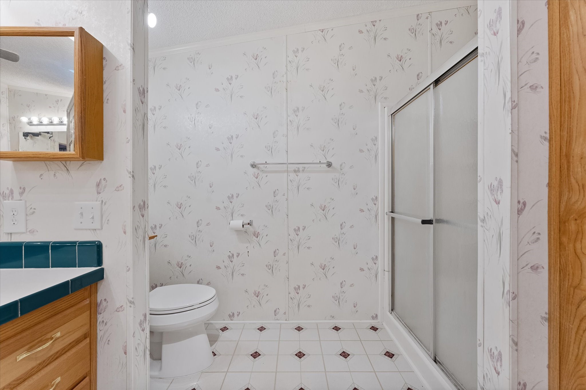 23419 Quiet Hollow Road Montgomery, TX 77356 - Photo 13 of 46 a bathroom with a toilet and a shower