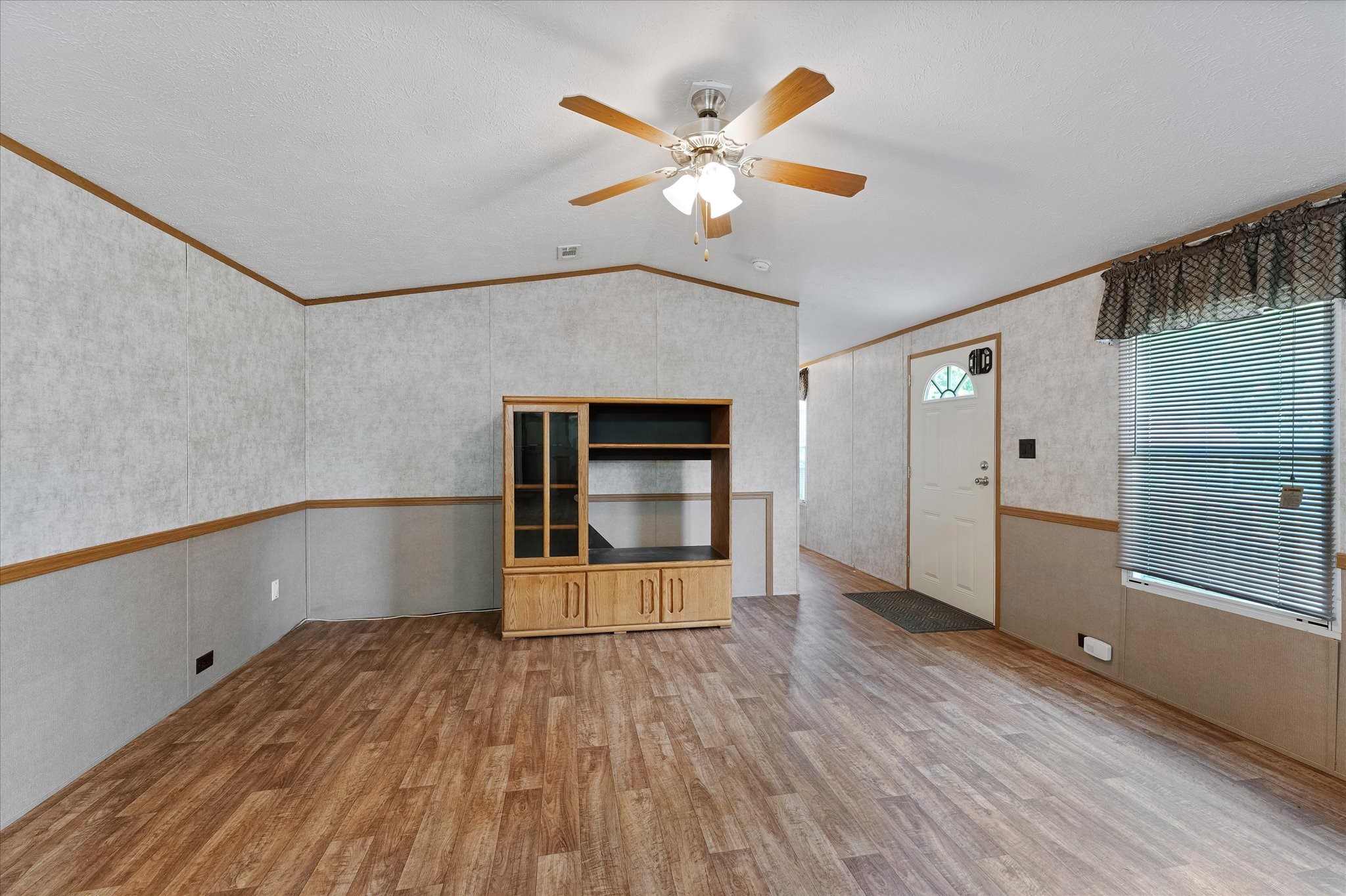 23419 Quiet Hollow Road Montgomery, TX 77356 - Photo 23 of 46 wooden floor in an empty room with a window
