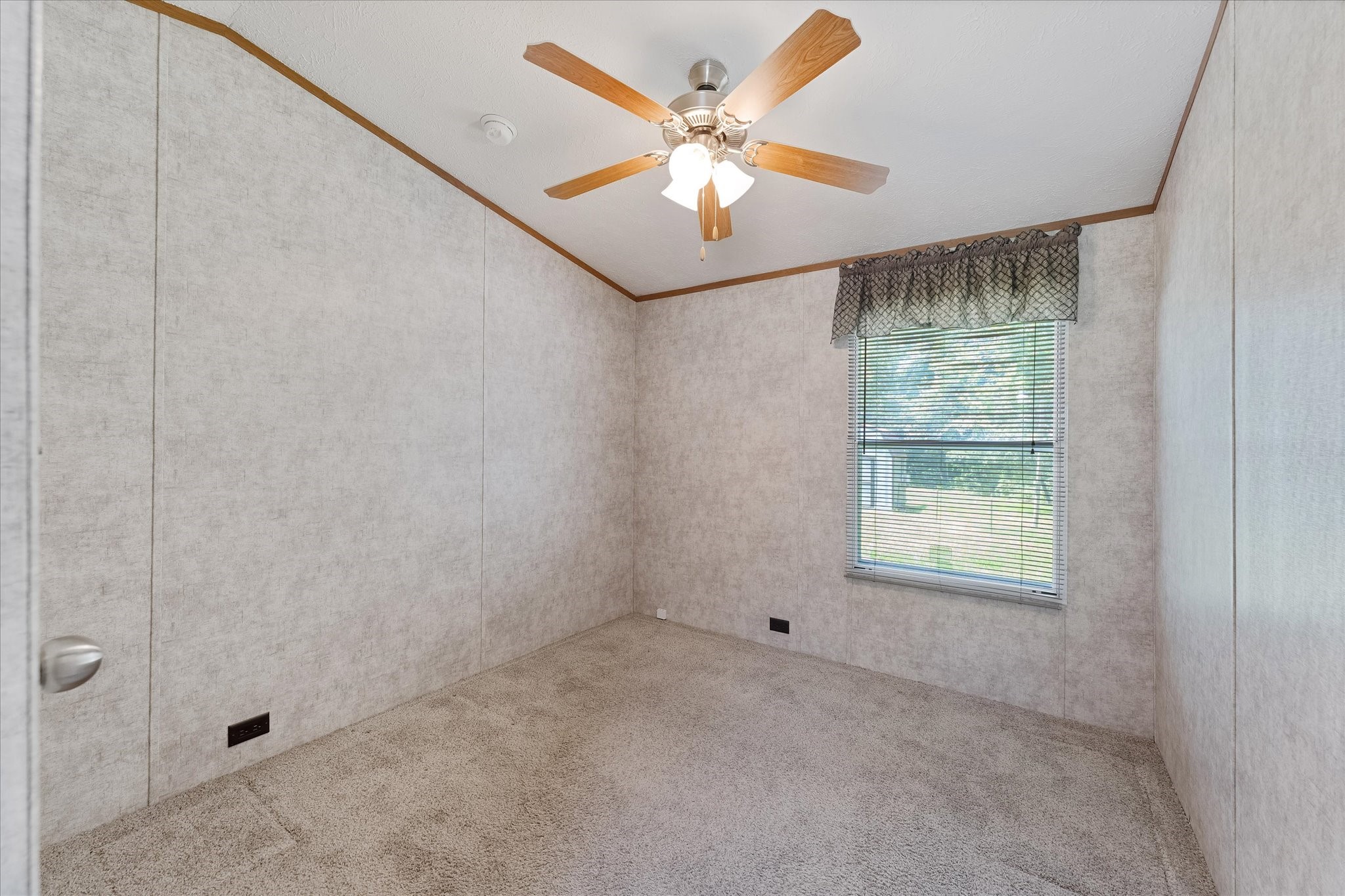 23419 Quiet Hollow Road Montgomery, TX 77356 - Photo 31 of 46 an empty room with windows and fan