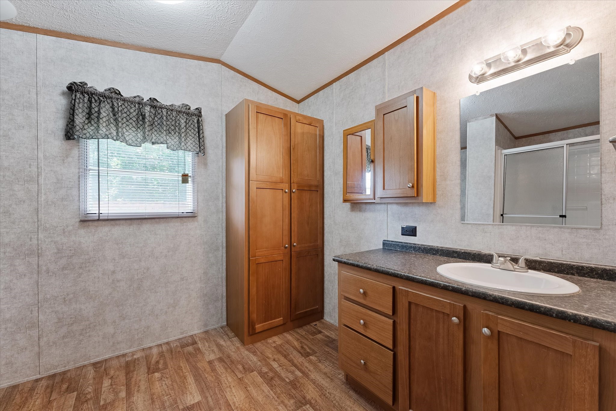 23419 Quiet Hollow Road Montgomery, TX 77356 - Photo 34 of 46 a bathroom with a sink and a mirror