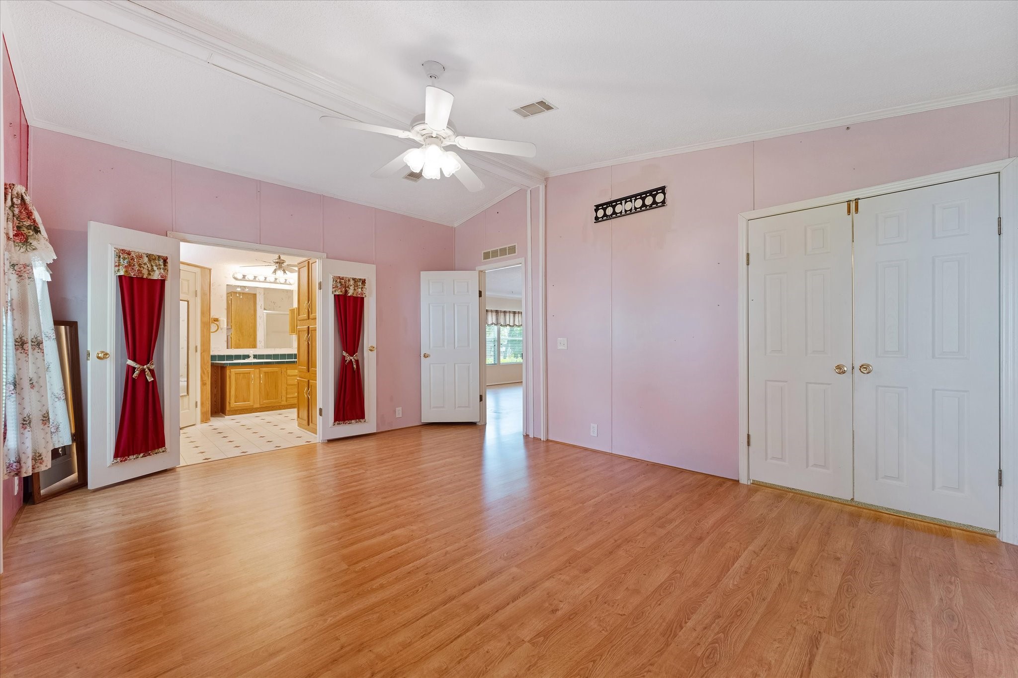 23419 Quiet Hollow Road Montgomery, TX 77356 - Photo 5 of 46 a view of an empty room with wooden floor and a window