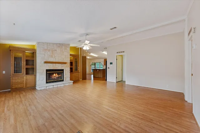 a view of a livingroom with a fireplace a fireplace and wooden floor