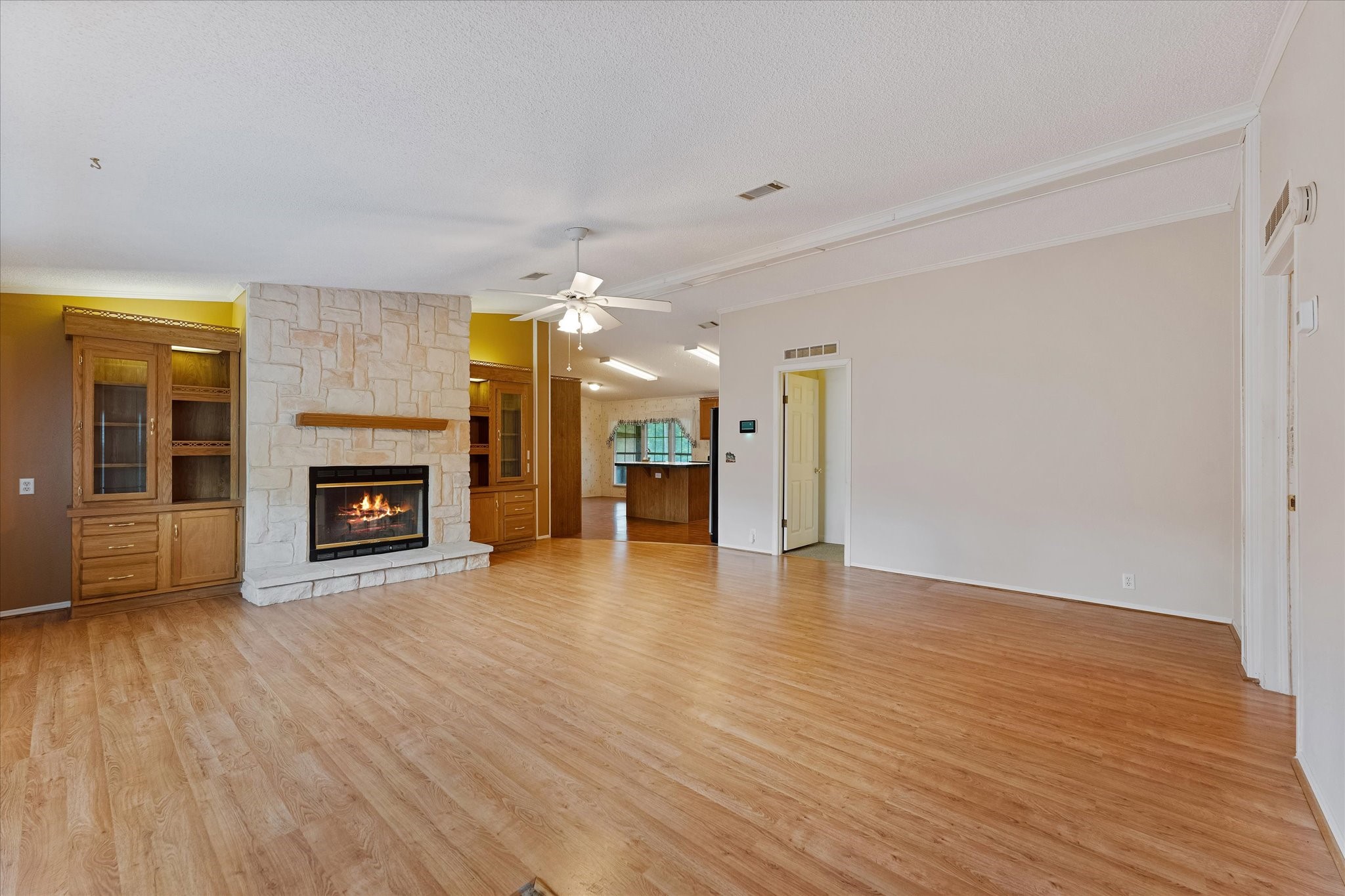23419 Quiet Hollow Road Montgomery, TX 77356 - Photo 6 of 46 a view of a livingroom with a fireplace a fireplace and wooden floor