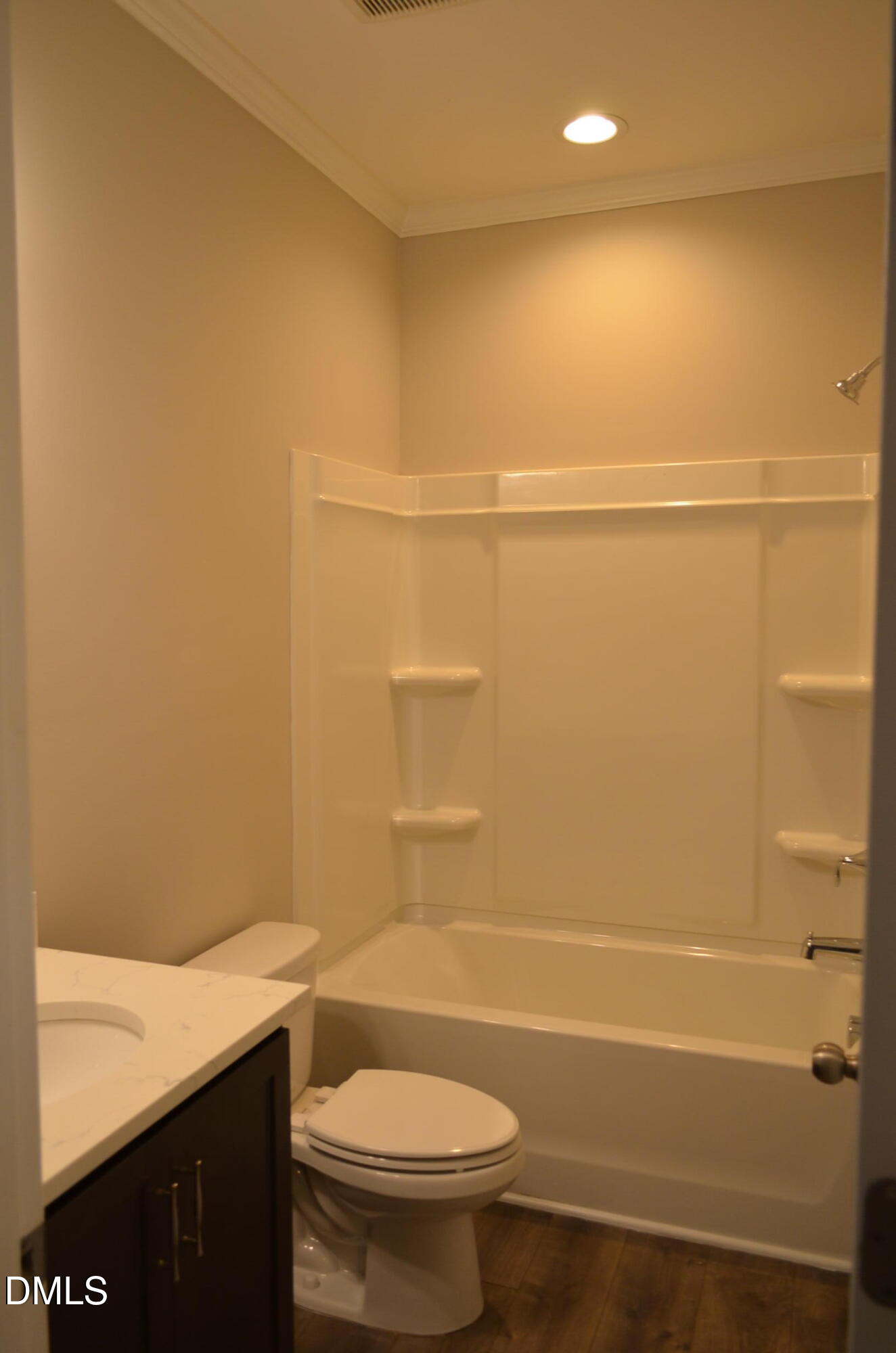 6506 Perry Creek Road, Unit 1103 Raleigh, NC 27616 - Photo 12 of 34 a bathroom with a shower a toilet and sink