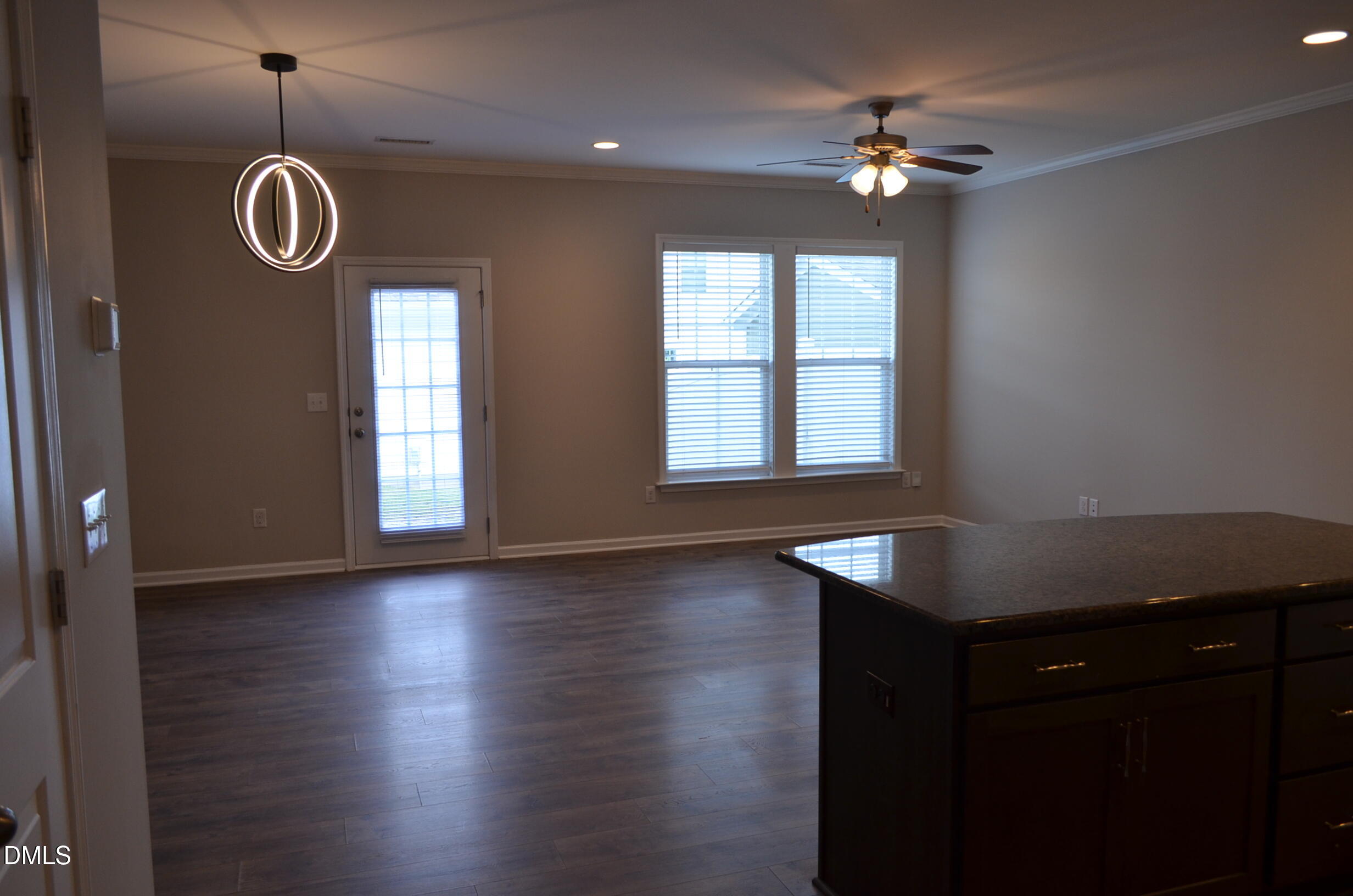 6506 Perry Creek Road, Unit 1103 Raleigh, NC 27616 - Photo 13 of 34 a view of a livingroom with furniture wooden floor and a window