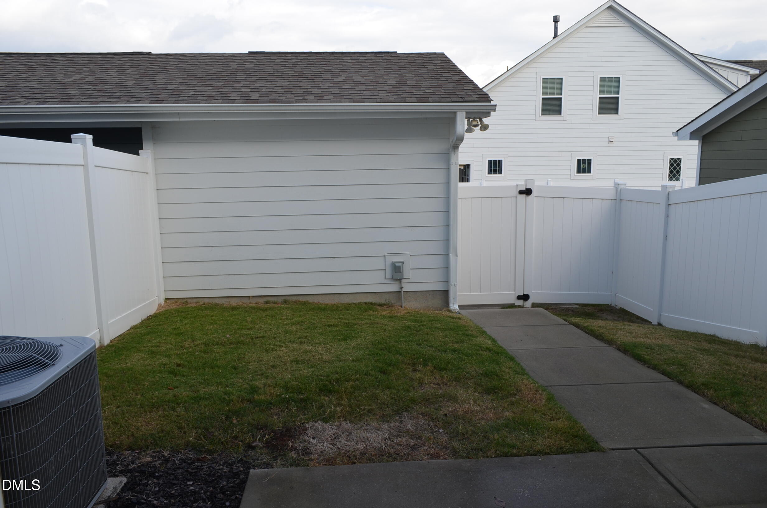 6506 Perry Creek Road, Unit 1103 Raleigh, NC 27616 - Photo 17 of 34 a house view with a backyard space