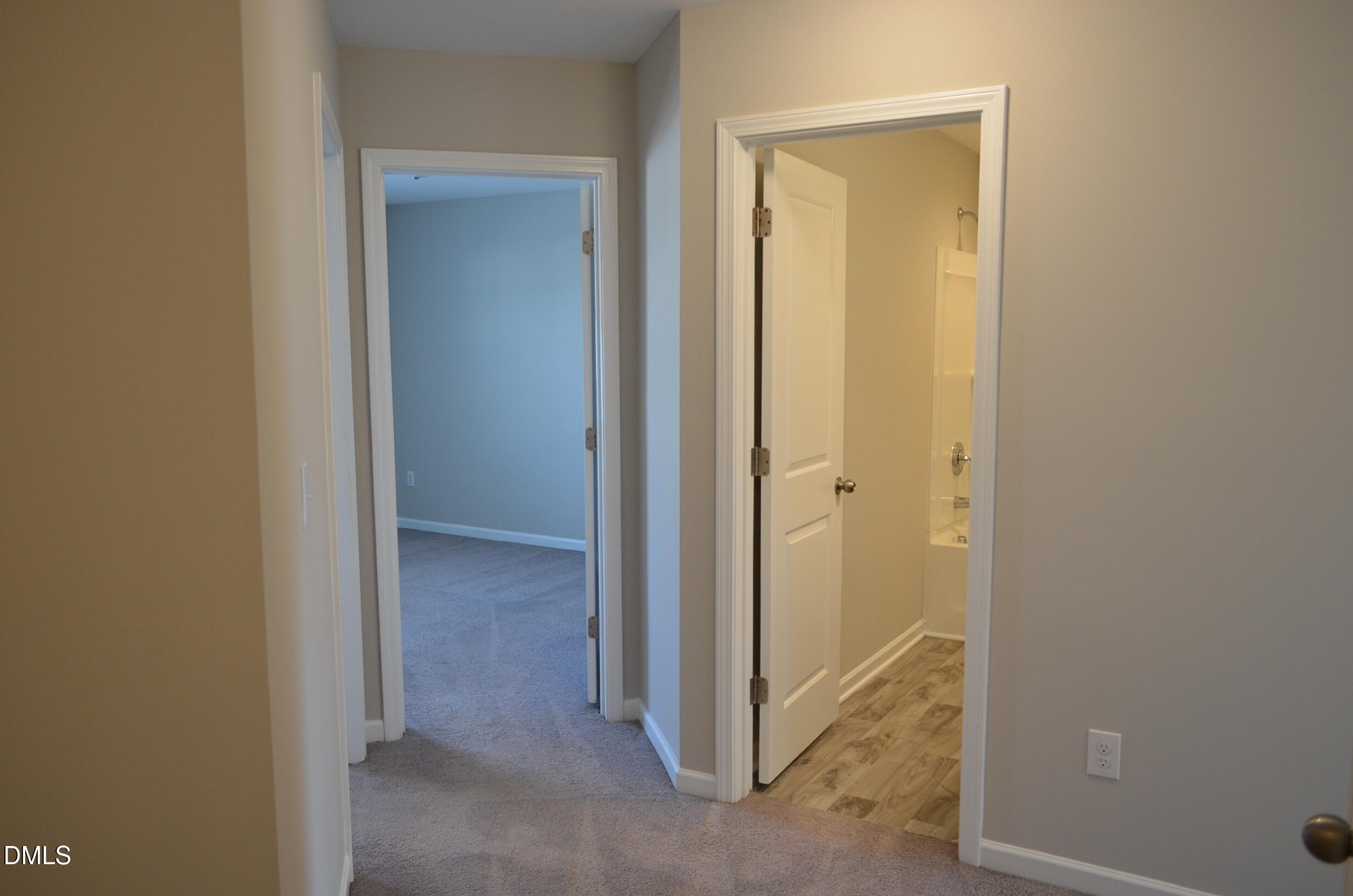 6506 Perry Creek Road, Unit 1103 Raleigh, NC 27616 - Photo 19 of 34 a view of a bathroom from a hallway