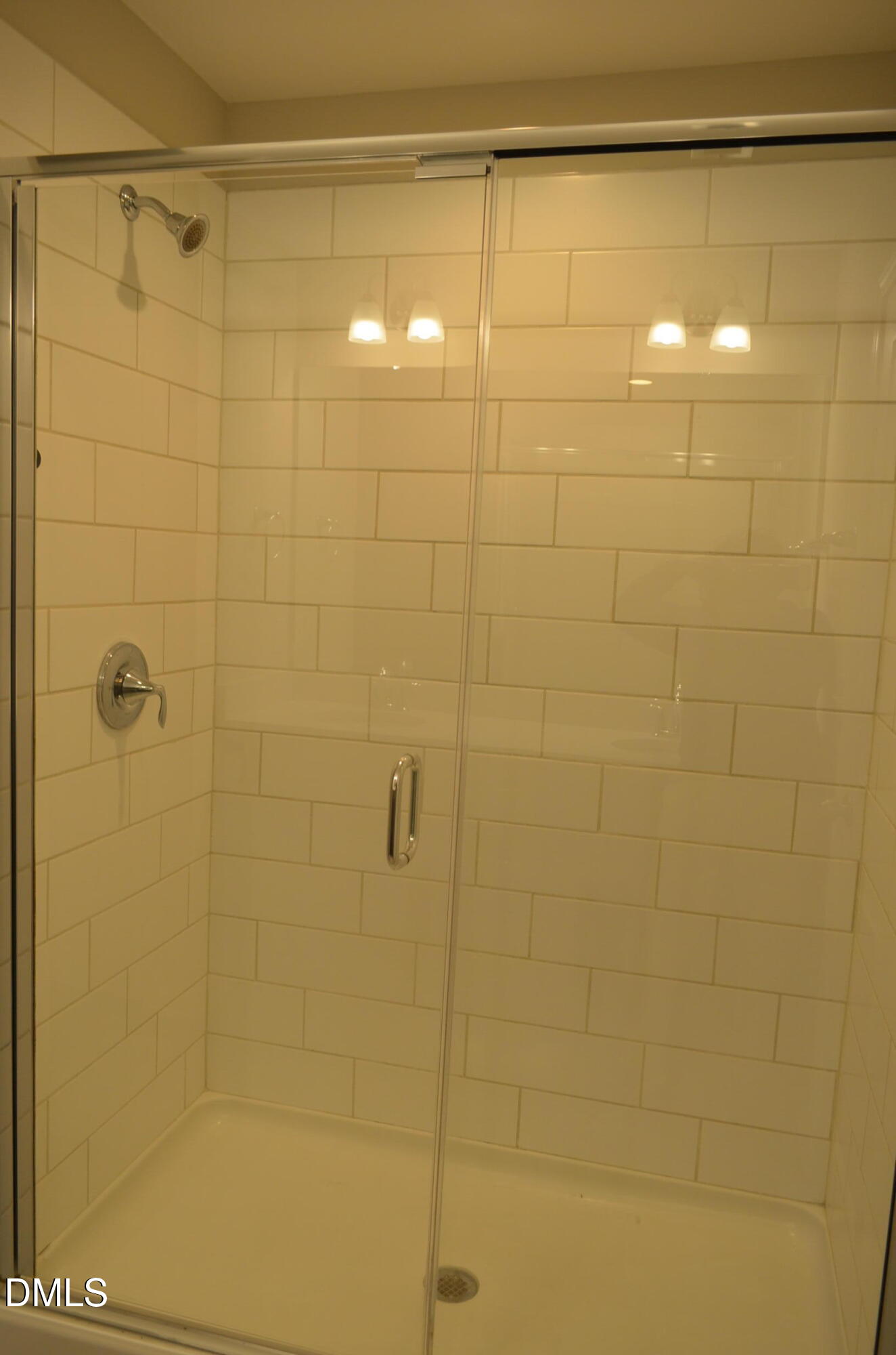 6506 Perry Creek Road, Unit 1103 Raleigh, NC 27616 - Photo 27 of 34 a bathroom with a shower