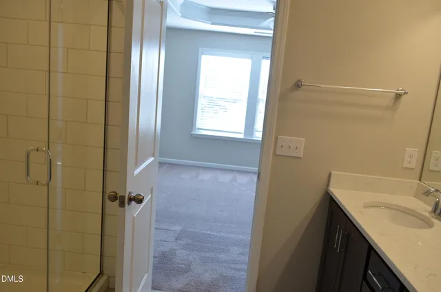 a bathroom with a sink a vanity and a mirror