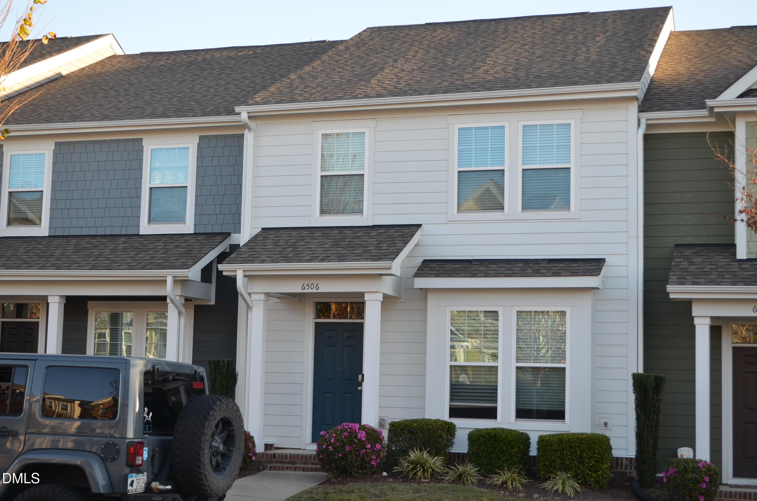 6506 Perry Creek Road, Unit 1103 Raleigh, NC 27616 - Photo 4 of 34 a front view of a house with many windows