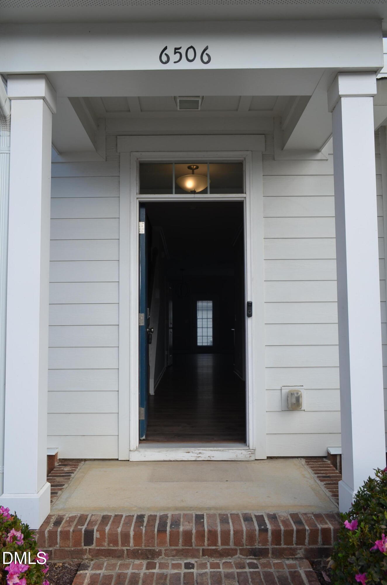 6506 Perry Creek Road, Unit 1103 Raleigh, NC 27616 - Photo 9 of 34 a view of wooden door