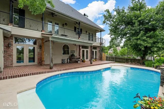a view of a house with swimming pool