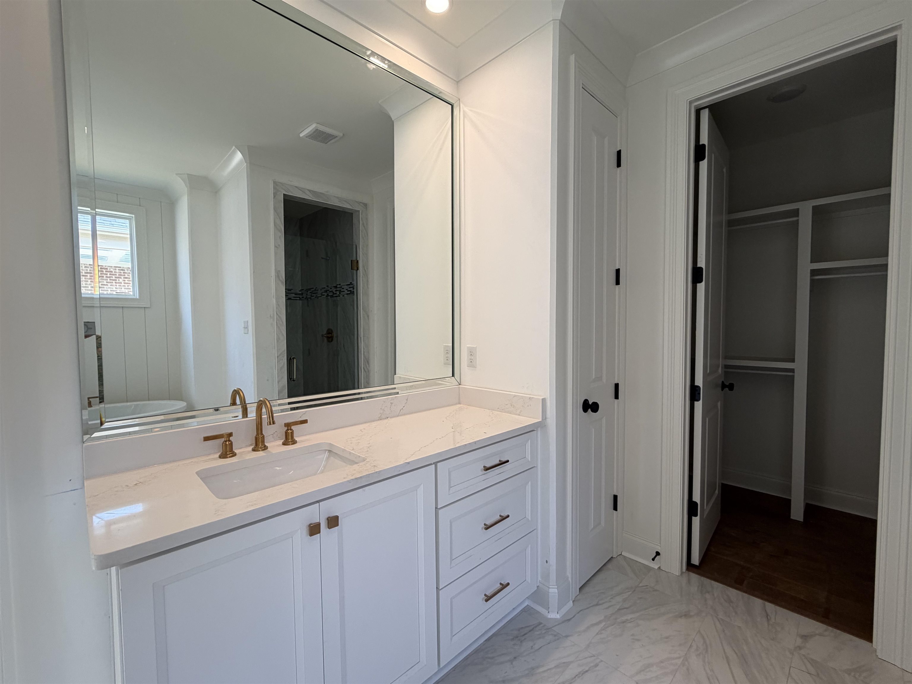 190 Rambling Rex Trail Piperton, TN 38017 - Photo 12 of 32 a bathroom with a double vanity sink and mirror