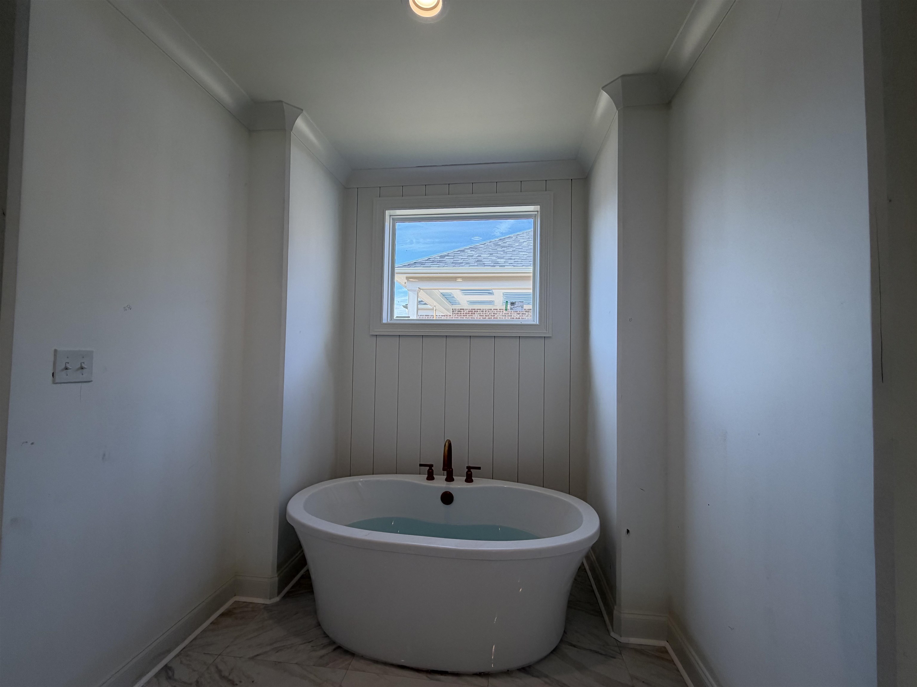 190 Rambling Rex Trail Piperton, TN 38017 - Photo 16 of 32 a white bath tub sitting in a bathroom