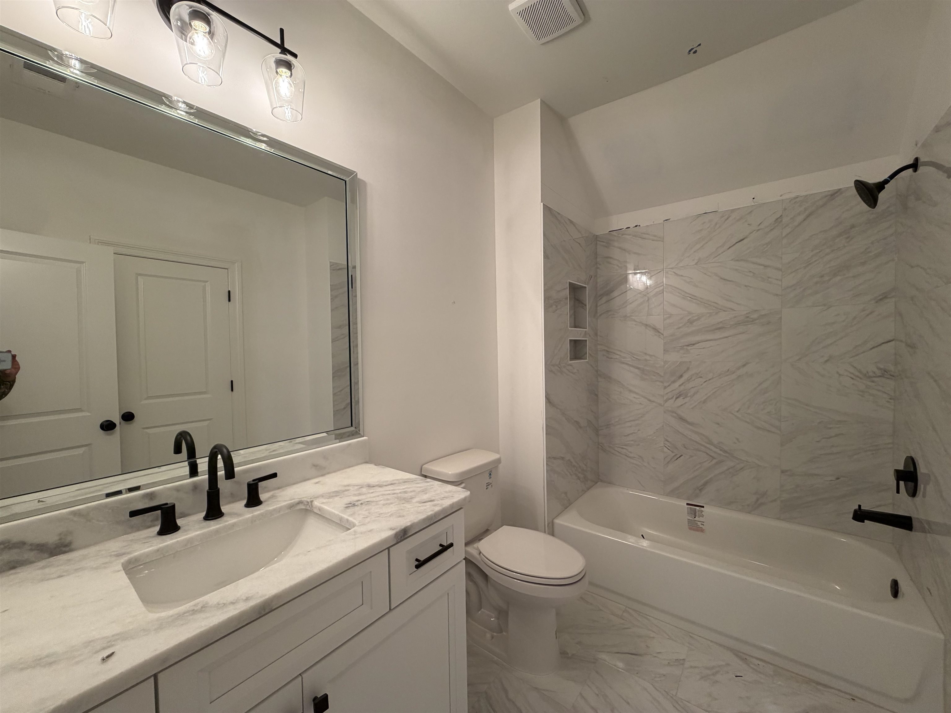 190 Rambling Rex Trail Piperton, TN 38017 - Photo 20 of 32 a bathroom with a sink a toilet and bathtub