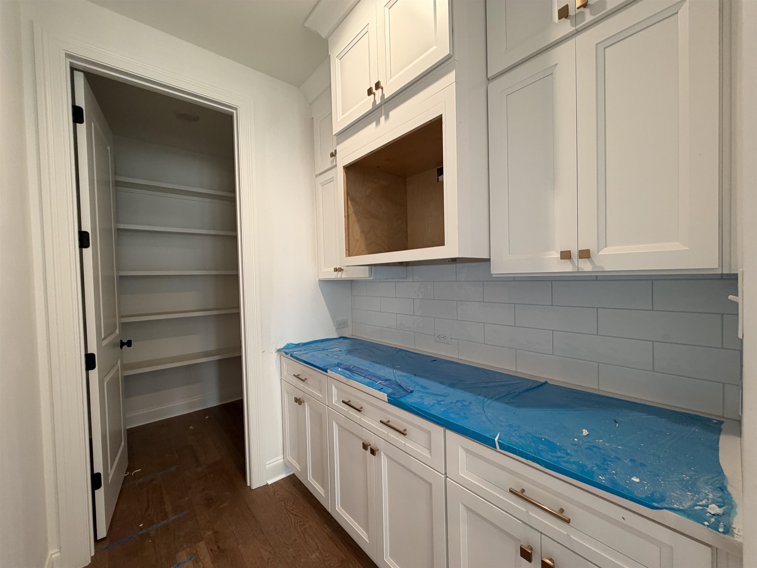 190 Rambling Rex Trail Piperton, TN 38017 - Photo 7 of 32 a kitchen with stainless steel appliances white cabinets and a stove