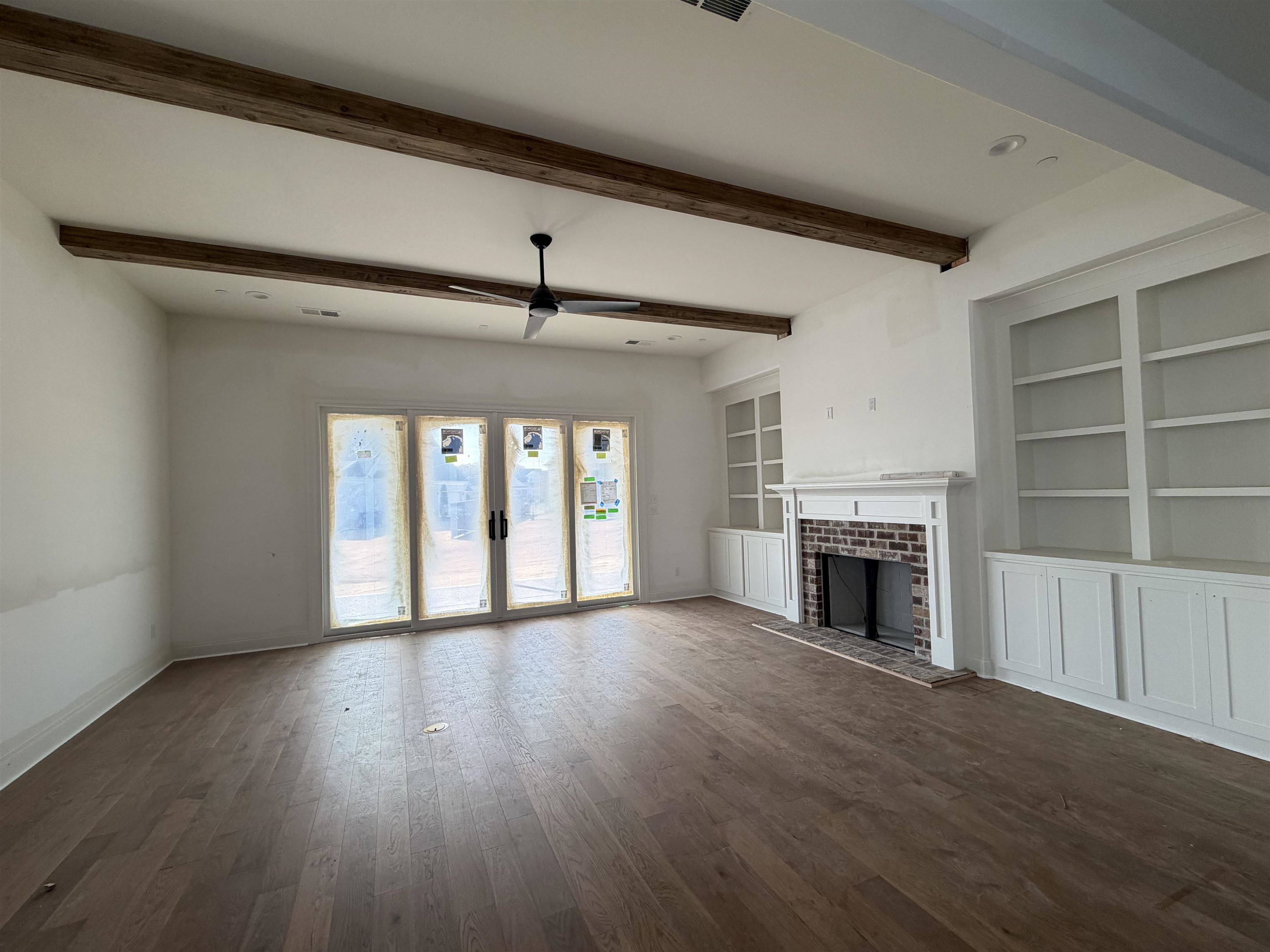 190 Rambling Rex Trail Piperton, TN 38017 - Photo 9 of 32 a view of an empty room with a fireplace and a window