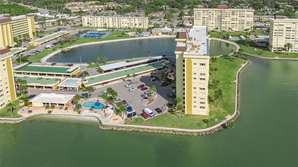4775 Cove Circle, Unit 1002 Madeira Beach, FL 33708 - Photo 2 of 60 a view of swimming pool with a balcony