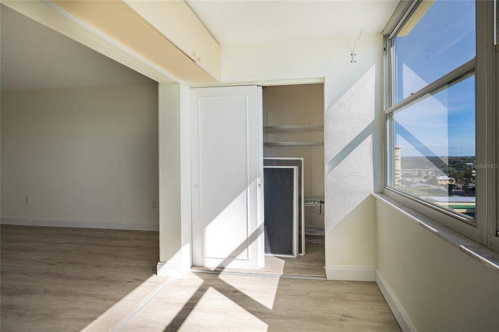 4775 Cove Circle, Unit 1002 Madeira Beach, FL 33708 - Photo 21 of 60 a view of an entryway with wooden floor