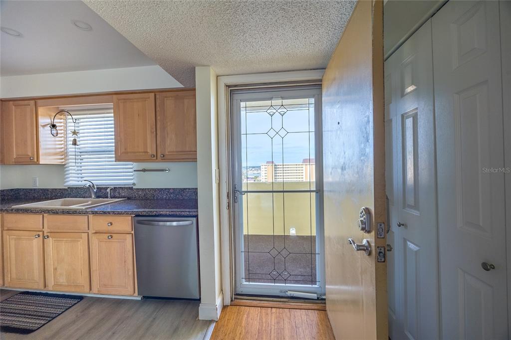 4775 Cove Circle, Unit 1002 Madeira Beach, FL 33708 - Photo 33 of 60 a bathroom with a granite countertop sink and a mirror