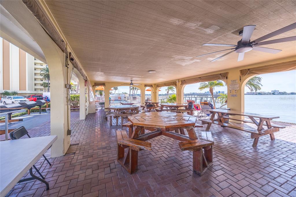 4775 Cove Circle, Unit 1002 Madeira Beach, FL 33708 - Photo 38 of 60 a view of a dining room with furniture