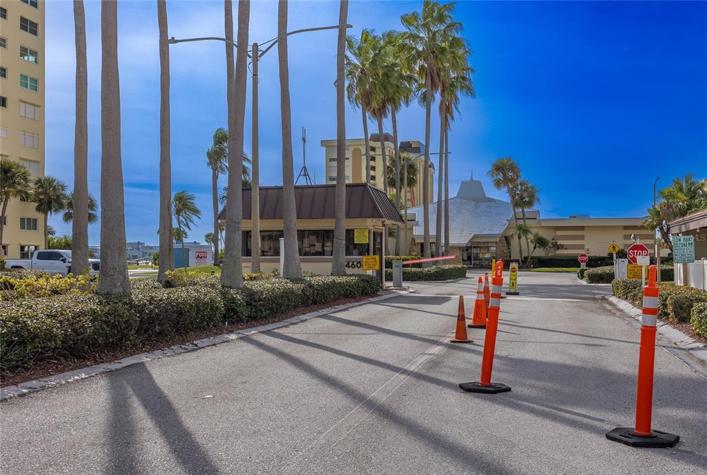4775 Cove Circle, Unit 1002 Madeira Beach, FL 33708 - Photo 43 of 60 a front view of a building with sign board