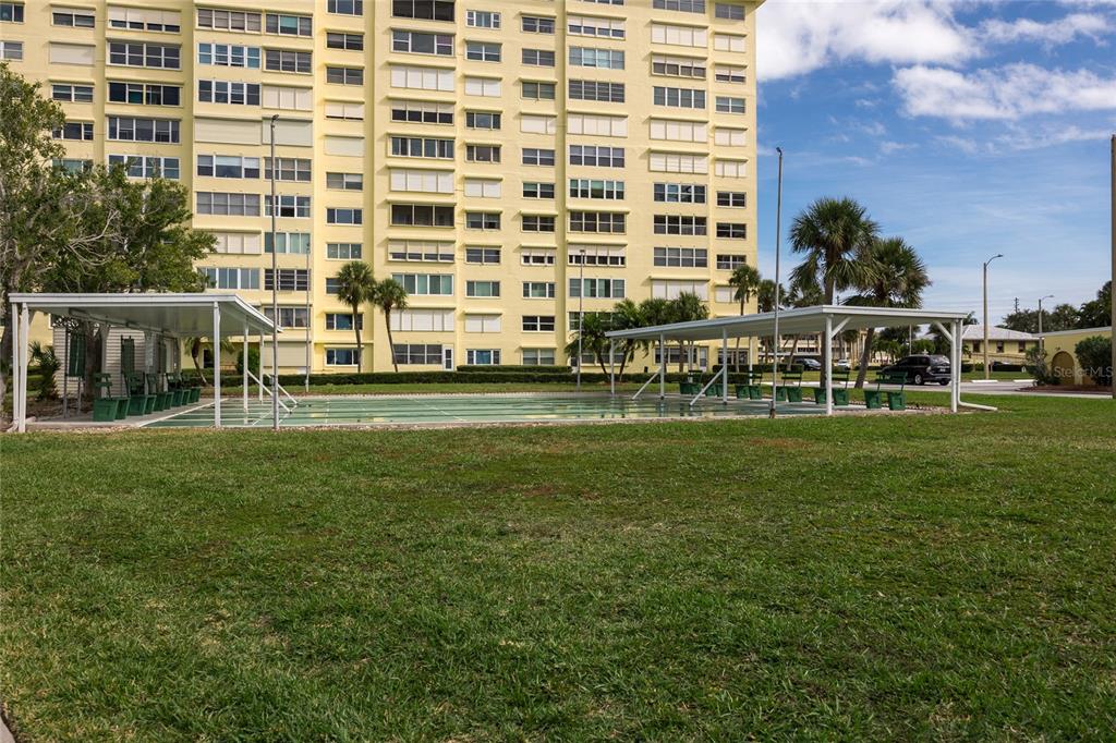 4775 Cove Circle, Unit 1002 Madeira Beach, FL 33708 - Photo 5 of 60 a view of building with outdoor space