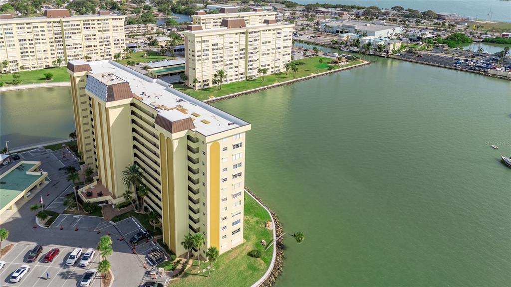 4775 Cove Circle, Unit 1002 Madeira Beach, FL 33708 - Photo 56 of 60 a view of a balcony with chairs