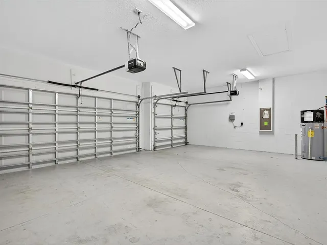 a view of an empty room with a ceiling fan