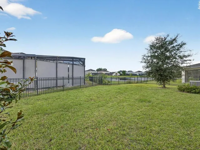 a backyard of a house with lots of green space