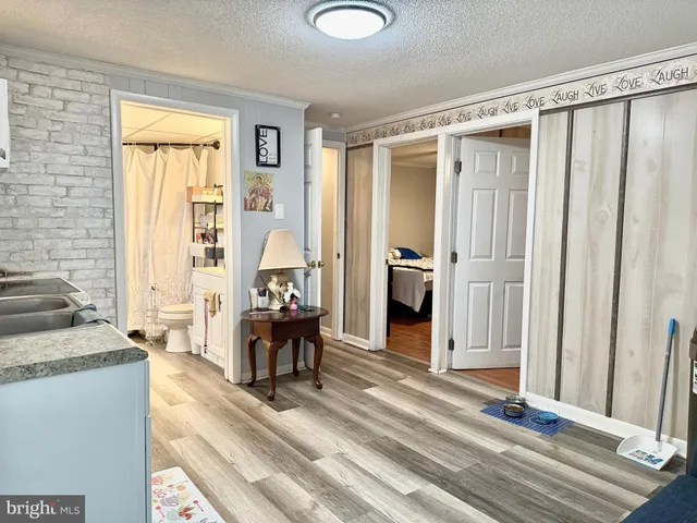 a living room with furniture and large windows