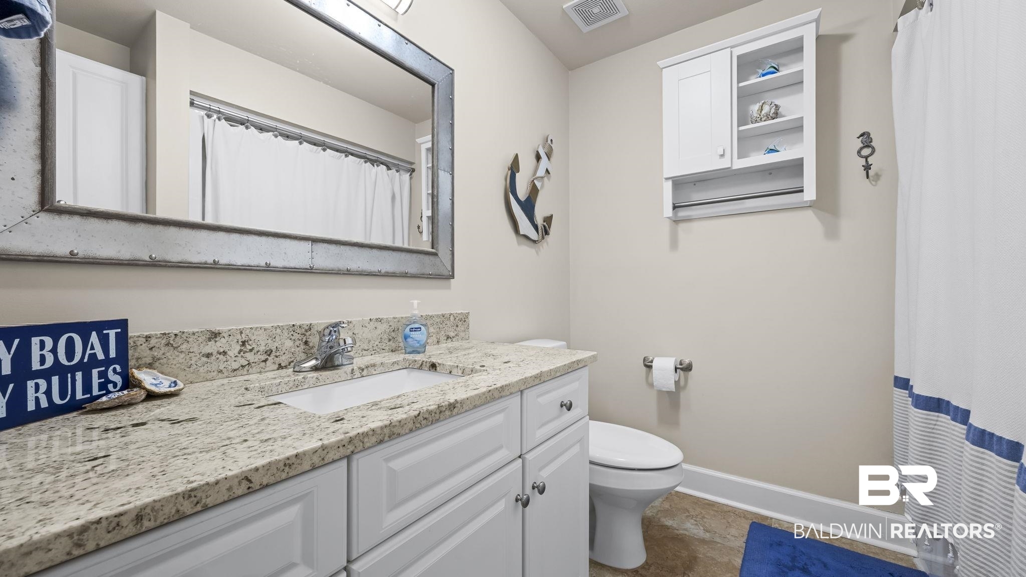 27580 Canal Road, Unit 1526 Orange Beach, AL 36561 - Photo 25 of 49 Full bathroom with vanity and a shower with shower curtain