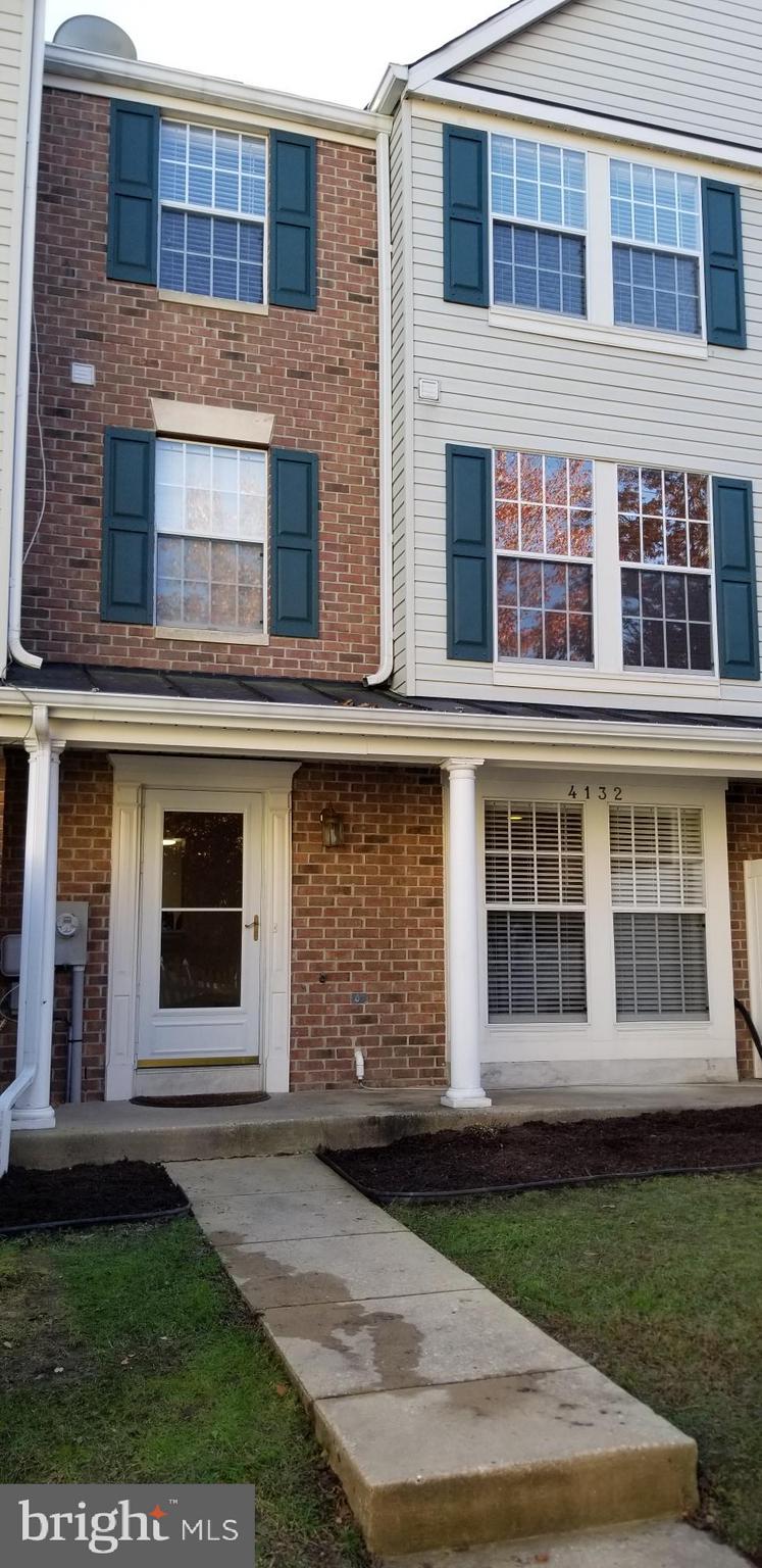 4132 Maple Path Circle, Unit 61 Baltimore, MD 21236 - Photo 2 of 47 a front view of a house with garden