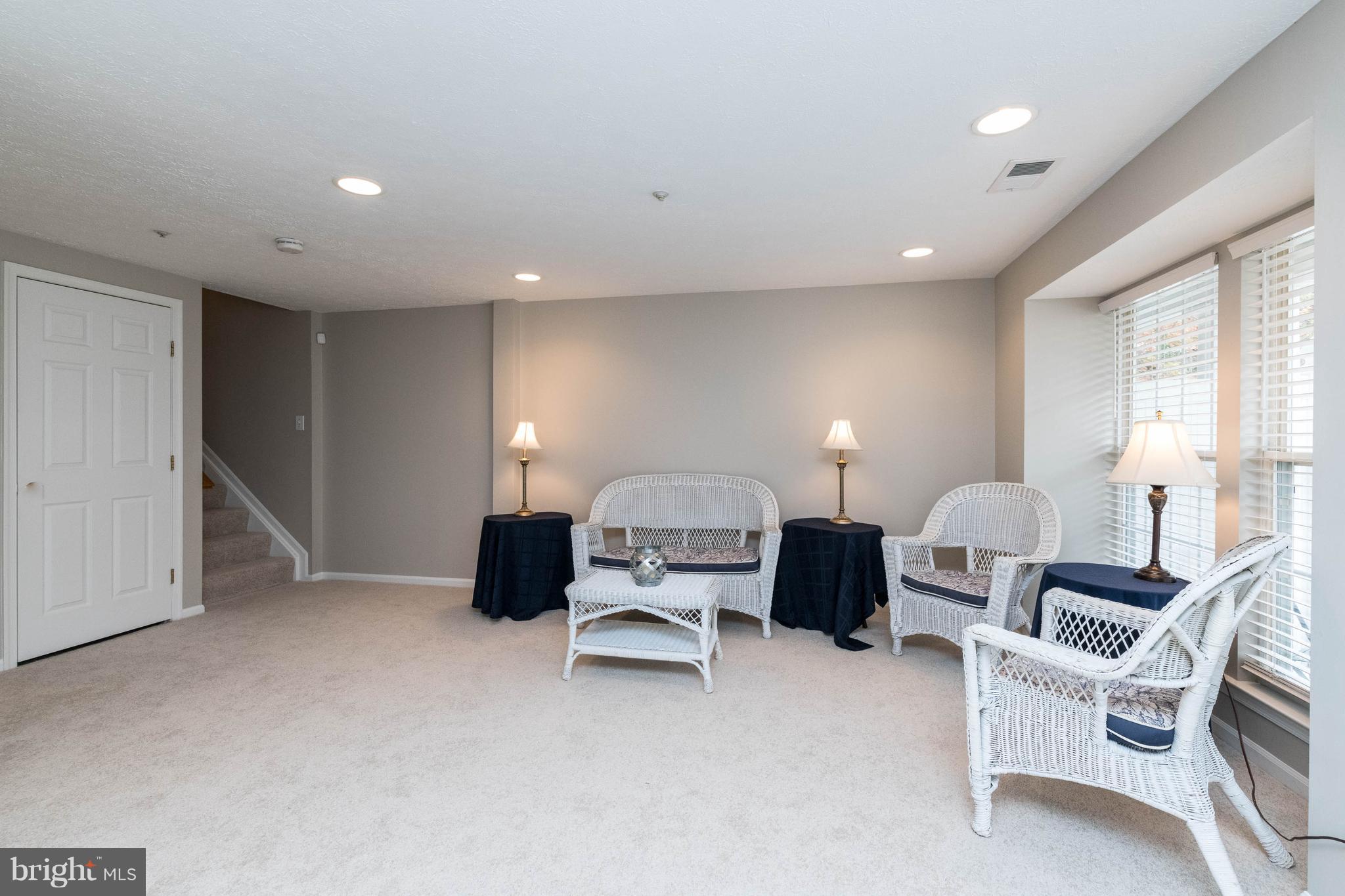 4132 Maple Path Circle, Unit 61 Baltimore, MD 21236 - Photo 11 of 47 a living room with furniture and a lamp