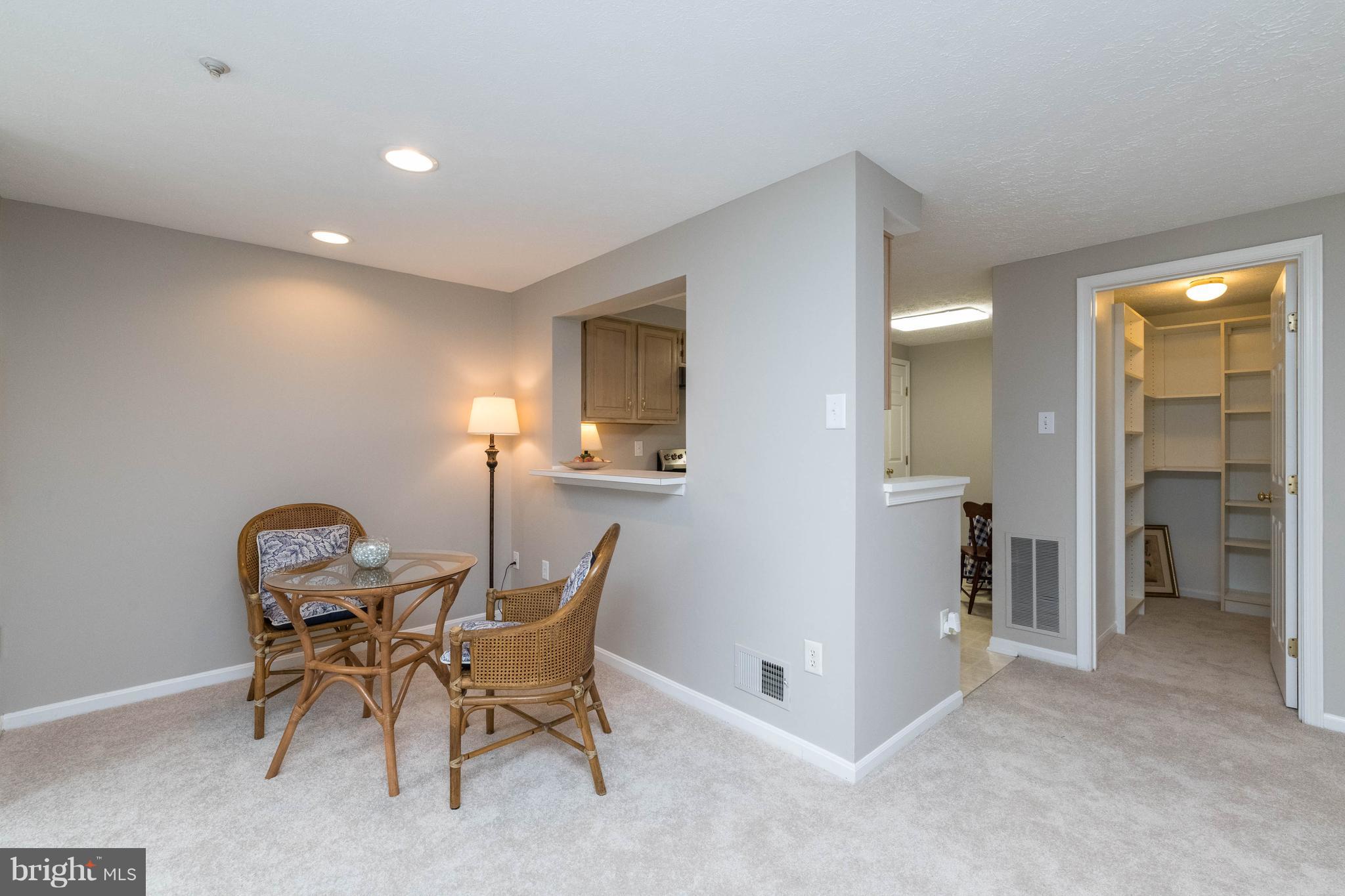 4132 Maple Path Circle, Unit 61 Baltimore, MD 21236 - Photo 13 of 47 a view of a room with table and chair