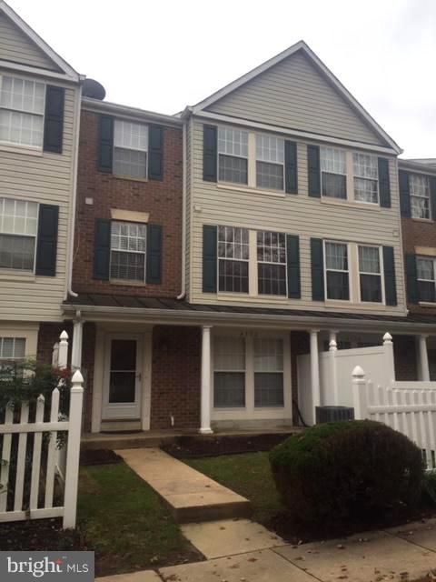 4132 Maple Path Circle, Unit 61 Baltimore, MD 21236 - Photo 3 of 47 a front view of a house with a yard