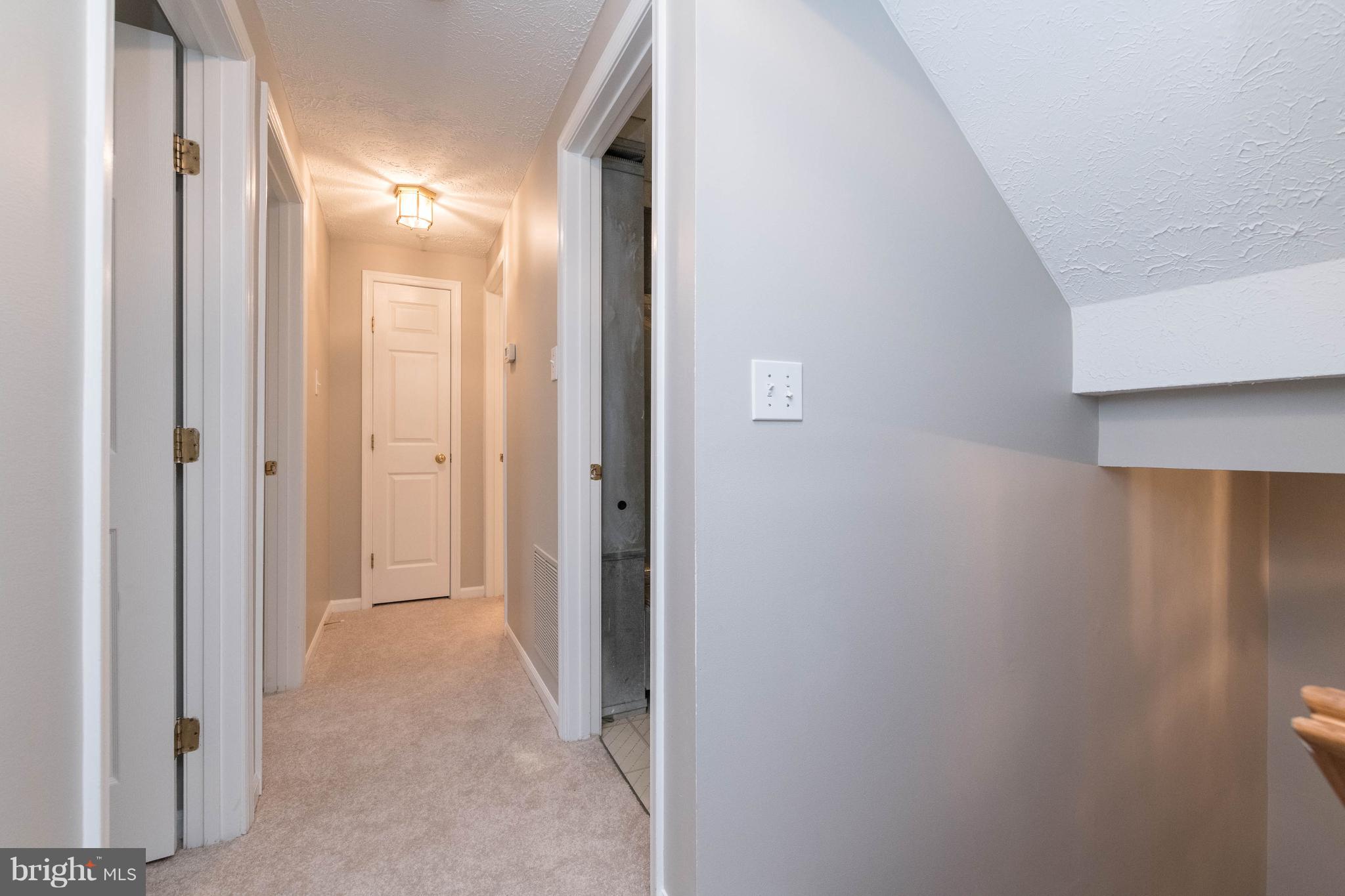 4132 Maple Path Circle, Unit 61 Baltimore, MD 21236 - Photo 21 of 47 a view of a bathroom from a hallway