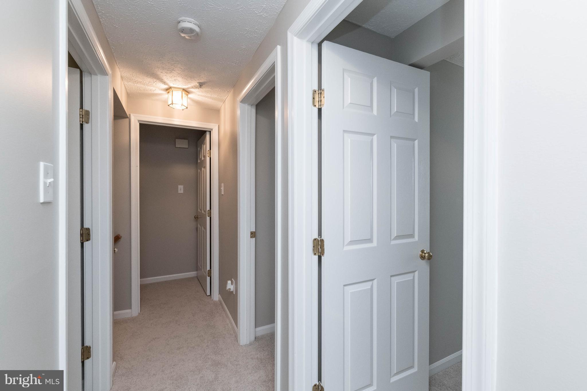 4132 Maple Path Circle, Unit 61 Baltimore, MD 21236 - Photo 22 of 47 a view of a hallway with wooden floor