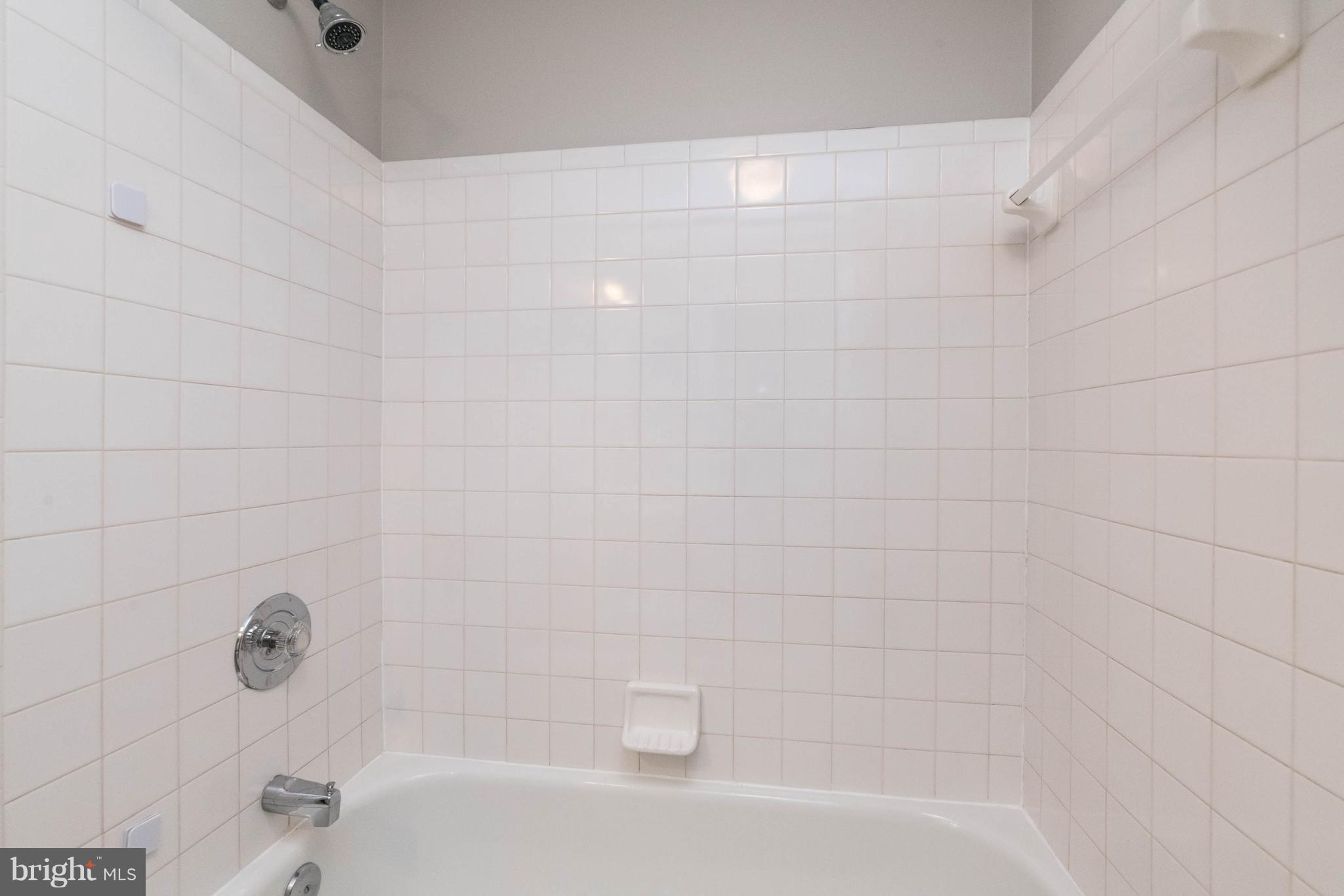 4132 Maple Path Circle, Unit 61 Baltimore, MD 21236 - Photo 31 of 47 a bathroom with a bathtub