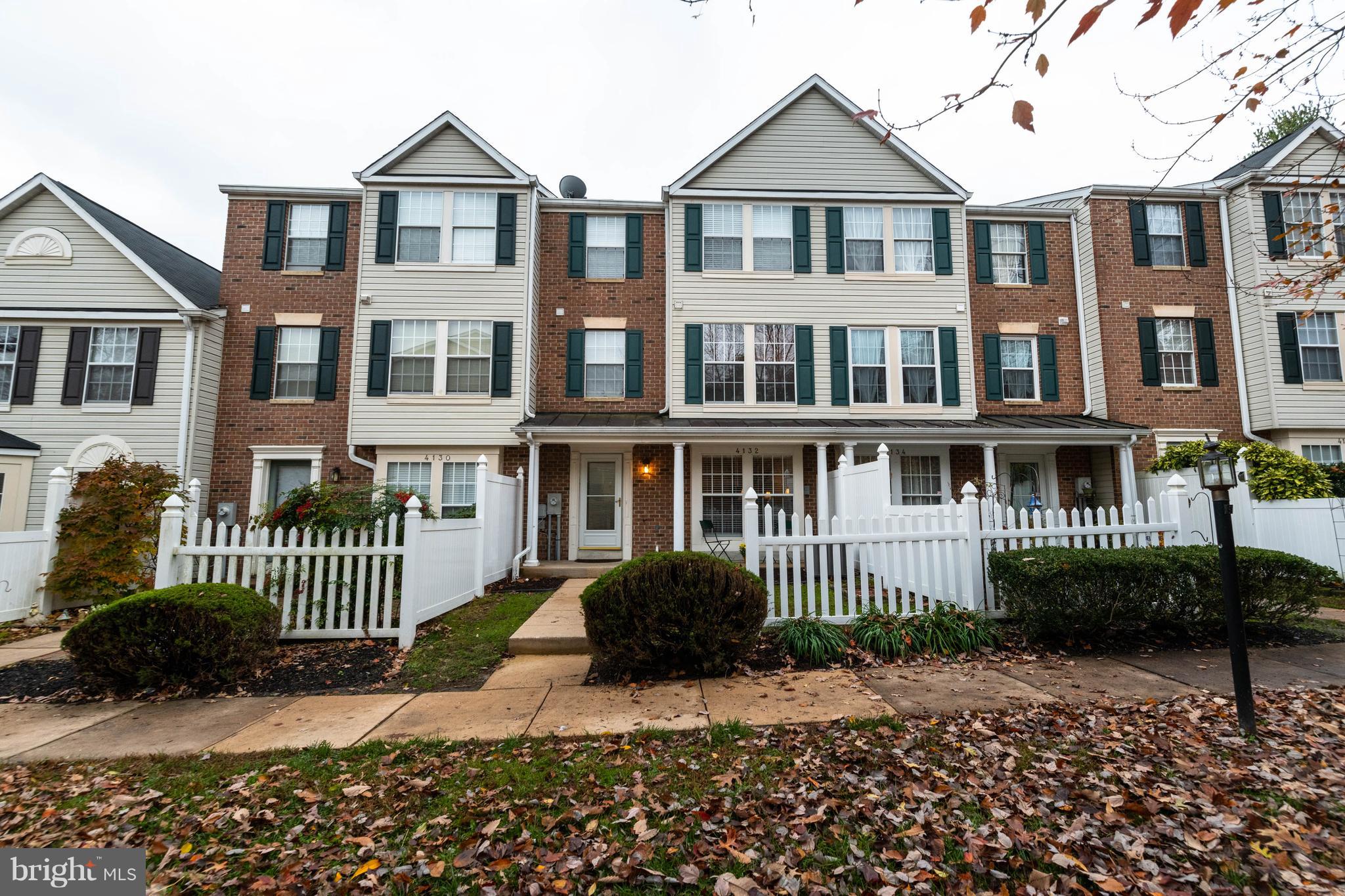 4132 Maple Path Circle, Unit 61 Baltimore, MD 21236 - Photo 5 of 47 a front view of a house with a garden
