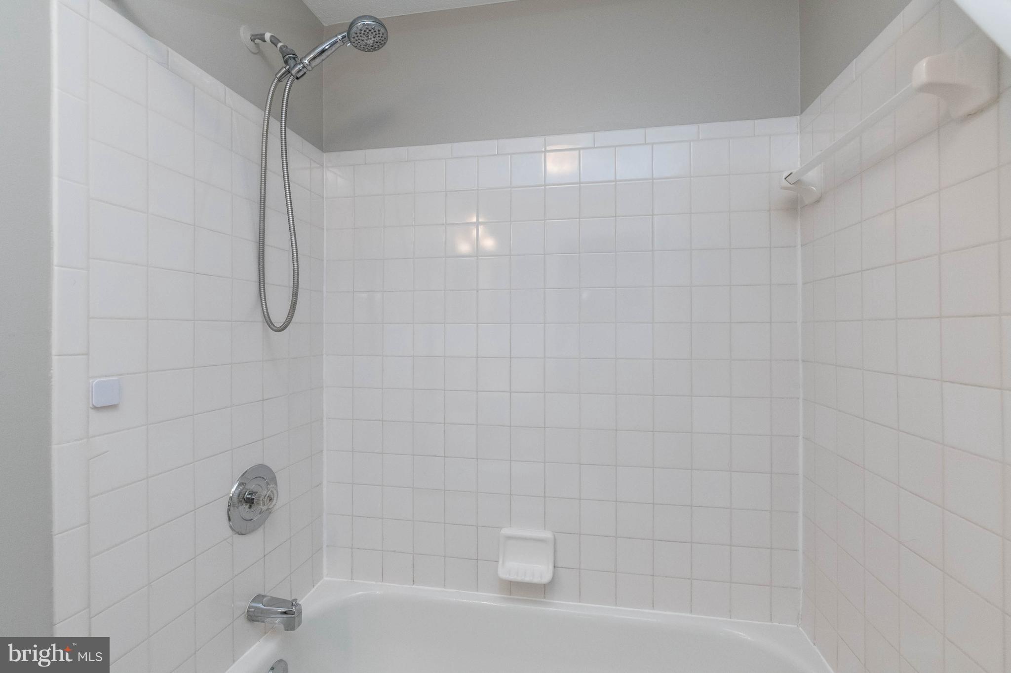 4132 Maple Path Circle, Unit 61 Baltimore, MD 21236 - Photo 43 of 47 a bathroom with a shower and a bath tub
