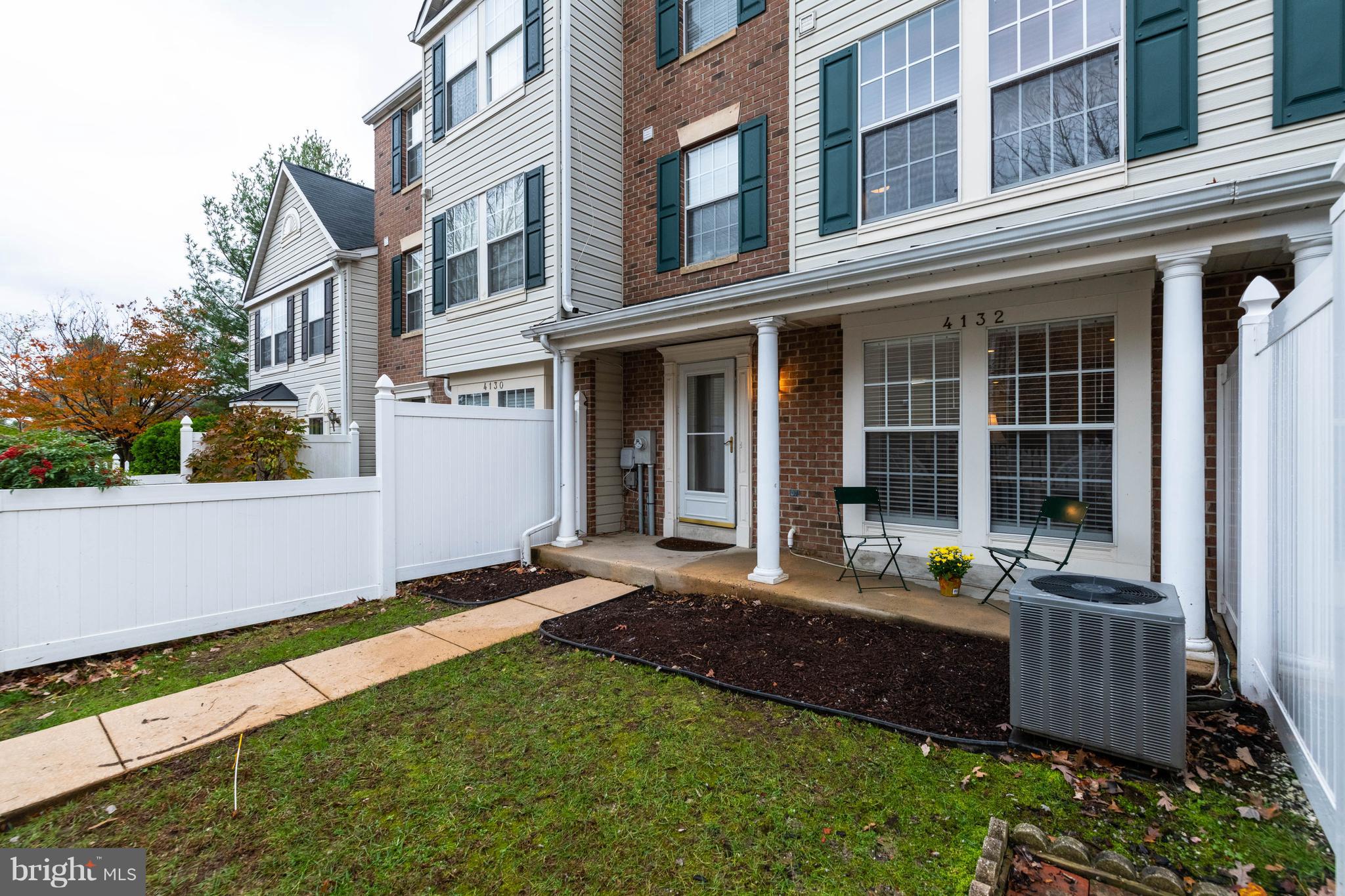 4132 Maple Path Circle, Unit 61 Baltimore, MD 21236 - Photo 45 of 47 a view of a building with many windows and plants
