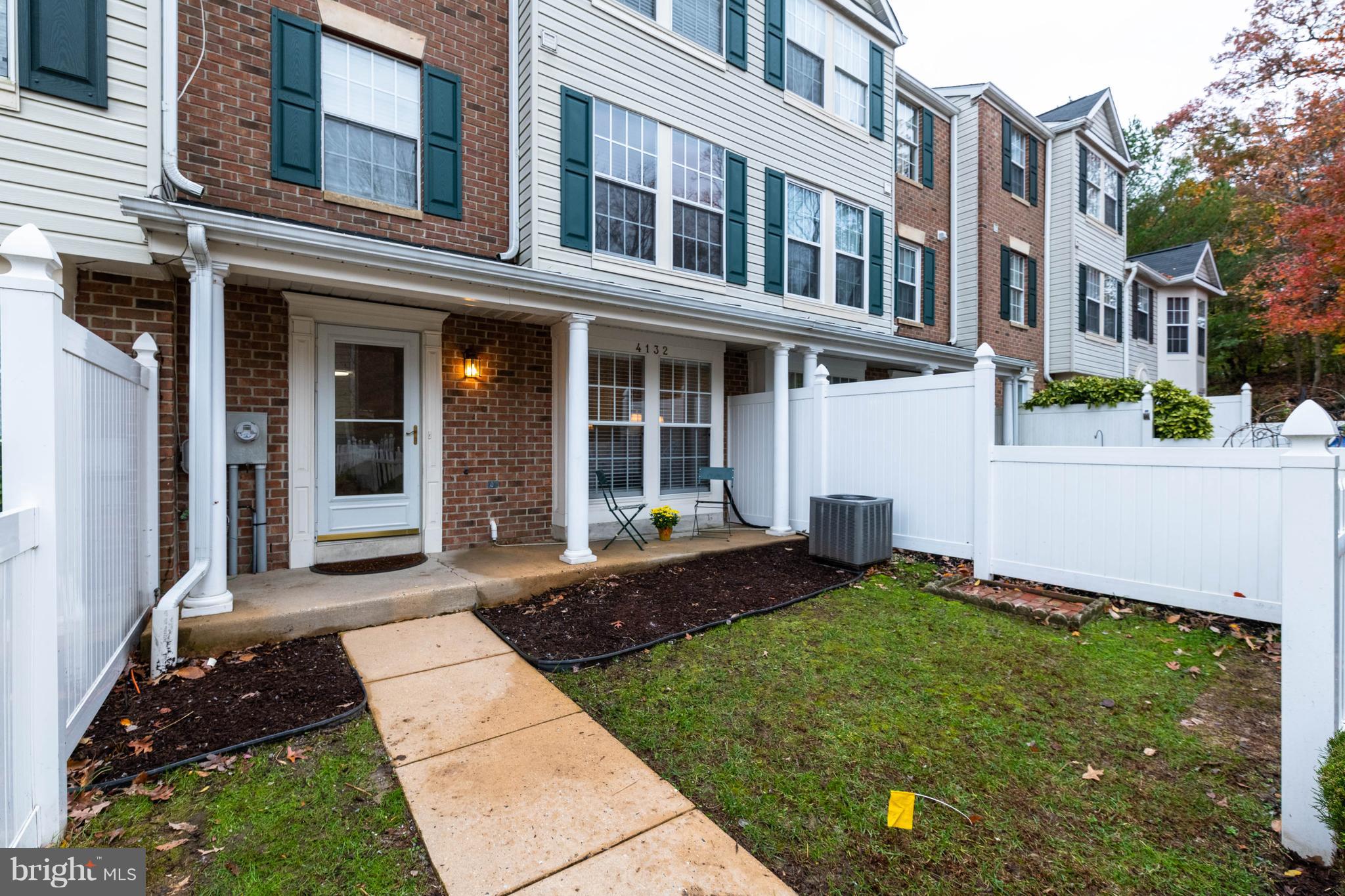 4132 Maple Path Circle, Unit 61 Baltimore, MD 21236 - Photo 46 of 47 a front view of a house with a yard