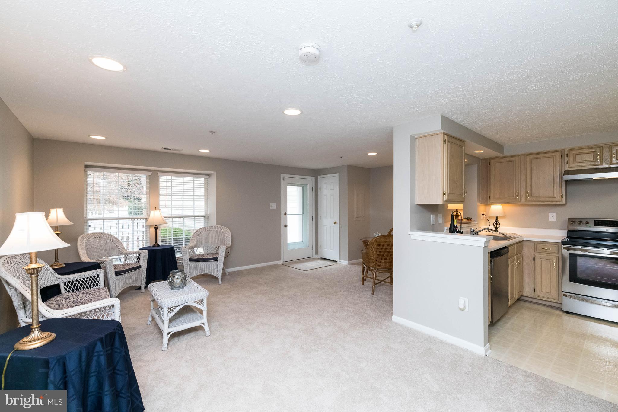 4132 Maple Path Circle, Unit 61 Baltimore, MD 21236 - Photo 9 of 47 a living room with furniture and kitchen