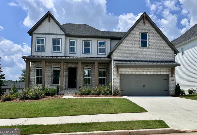 a view of a yard in front view of a house