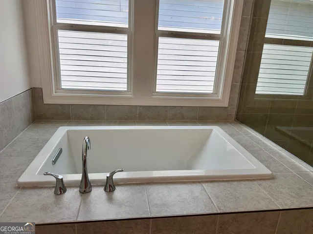 a bathroom with a bathtub