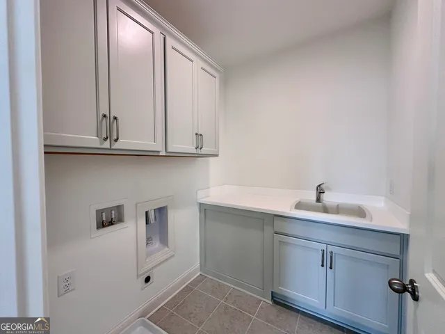 a bathroom with a sink and cabinets