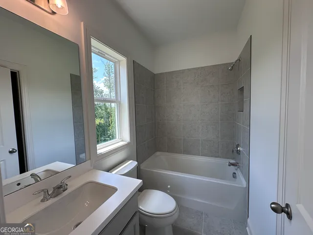 a bathroom with a sink toilet bathtub and shower